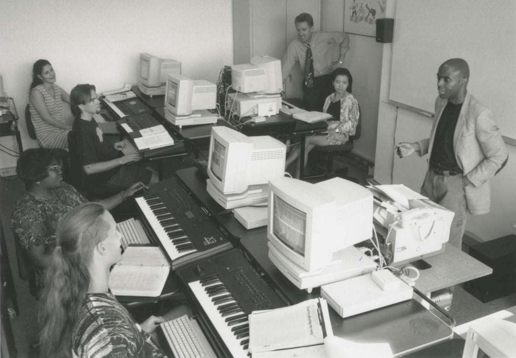 Instructs students in the Professional Education Division Technology Lab, c. 1994