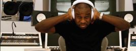 a closeup image of Leslie Brathwaite in a studio wearing headphones